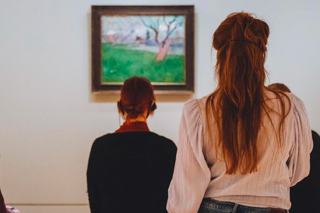 women watching van Gogh painting while listening to podcast open up with vincent